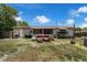 The backyard features a grill, seating area and kayaks at 565 S Floyd Cir, Deltona, FL 32725
