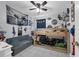 Fun bedroom with a bunk bed, gray couch, and lots of decorations at 565 S Floyd Cir, Deltona, FL 32725