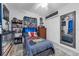 Nicely decorated bedroom with a striped bedspread, a mirror, and a shelf at 565 S Floyd Cir, Deltona, FL 32725