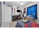 Well decorated bedroom featuring a striped bedspread, a tv, and a shelf at 565 S Floyd Cir, Deltona, FL 32725