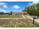 Charming single-story home featuring a welcoming front porch and covered parking at 565 S Floyd Cir, Deltona, FL 32725