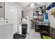 The laundry room has a washer and dryer, shelving, and a gray tiled floor at 565 S Floyd Cir, Deltona, FL 32725