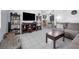 Open living room with tile flooring, stylish decor, and seamless flow to the dining area at 565 S Floyd Cir, Deltona, FL 32725