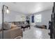 Inviting living room with tile flooring, a large sectional sofa, and lots of light at 565 S Floyd Cir, Deltona, FL 32725
