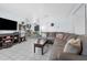 Open living room with tile flooring, stylish decor, and seamless flow to the dining area at 565 S Floyd Cir, Deltona, FL 32725