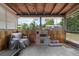 An enclosed patio with wood paneling, large windows, and a play area at 565 S Floyd Cir, Deltona, FL 32725