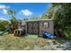 Exterior view of the property's storage shed in the backyard with a playset nearby at 565 S Floyd Cir, Deltona, FL 32725