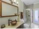 Bathroom features a unique vanity and sink, with a glass enclosed shower at 5740 Aloma Woods Blvd, Oviedo, FL 32765