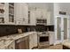 Modern kitchen with stainless steel appliances and granite countertops at 5740 Aloma Woods Blvd, Oviedo, FL 32765