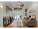 Cozy living room featuring wood floors, stylish decor, and access to outdoor pool at 5740 Aloma Woods Blvd, Oviedo, FL 32765
