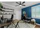 Home office features hardwood floors, built-in shelving, and plenty of room for two desks at 5740 Aloma Woods Blvd, Oviedo, FL 32765