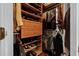 Well-organized walk-in closet with shelves, drawers, hanging racks and hardwood floor at 5740 Aloma Woods Blvd, Oviedo, FL 32765