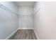 Walk-in closet featuring wood-look floors and wire shelving at 63 W 10Th St, Apopka, FL 32703