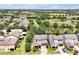 Aerial view showing homes, landscaping, and serene water features within the neighborhood at 6925 Trellis Vine Loop, Windermere, FL 34786