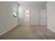 Bright bedroom with natural light, neutral carpet, and ample space at 6925 Trellis Vine Loop, Windermere, FL 34786