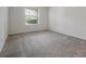 Bright and airy bedroom with natural light, carpet, and white walls at 6925 Trellis Vine Loop, Windermere, FL 34786