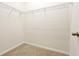 Walk-in closet featuring shelving and carpet flooring at 6925 Trellis Vine Loop, Windermere, FL 34786