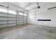 Spacious two-car garage with high ceilings and ample storage space at 6925 Trellis Vine Loop, Windermere, FL 34786
