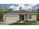 Charming single-story home with neutral exterior, well-maintained lawn, and attached two-car garage at 7415 Sandstone Dr, Groveland, FL 34736
