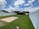 Expansive backyard featuring a patio area, green lawn, and privacy fence, ideal for Gathering gatherings at 7601 Fort Sumter Dr, Orlando, FL 32822