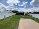 Well-maintained backyard featuring a patio, manicured lawn, and fenced perimeter, offering a private outdoor space at 7601 Fort Sumter Dr, Orlando, FL 32822
