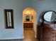 Stylish bathroom with a wooden vanity, framed mirror, and tile flooring, offering a clean and updated space at 7601 Fort Sumter Dr, Orlando, FL 32822