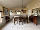 Elegant dining room features tile floors, chandelier, and stylish furnishings at 7601 Fort Sumter Dr, Orlando, FL 32822