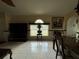 Bright dining area featuring large windows, vase centerpiece, and tile floors at 7601 Fort Sumter Dr, Orlando, FL 32822