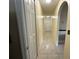 The yellow hallway has tile floors and multiple doors for access to other rooms at 7601 Fort Sumter Dr, Orlando, FL 32822
