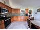 Kitchen featuring stainless steel appliances and wood cabinetry at 7601 Fort Sumter Dr, Orlando, FL 32822