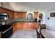 Kitchen with light-colored wood cabinets, backsplash, and stainless steel appliances at 7601 Fort Sumter Dr, Orlando, FL 32822
