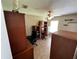 This office has a desk, chair, bookshelf, ceiling fan, and overhead lighting at 7601 Fort Sumter Dr, Orlando, FL 32822