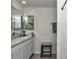Bright bathroom with double sinks, a vanity, and stylish fixtures with a shower visible at 8618 Sw 46Th Ave, Ocala, FL 34476