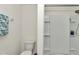 Clean bathroom featuring a toilet, shower, and tiled walls at 8618 Sw 46Th Ave, Ocala, FL 34476