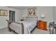 Comfortable bedroom featuring carpet, artwork, and coordinating nightstands at 8618 Sw 46Th Ave, Ocala, FL 34476