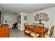 Inviting dining room with a wooden table, seating for four, and decorative wall art at 8618 Sw 46Th Ave, Ocala, FL 34476