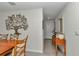 Hallway with decorative tree art piece, wood accents, tile floor, and interior door at 8618 Sw 46Th Ave, Ocala, FL 34476