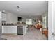 Open concept living area with tile flooring flowing into the kitchen area at 8618 Sw 46Th Ave, Ocala, FL 34476