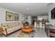 Bright living room with view of open floorplan into kitchen, tile flooring and modern decor at 8618 Sw 46Th Ave, Ocala, FL 34476