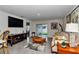 Comfortable living room with sliding glass door, modern furniture, and neutral colors at 8618 Sw 46Th Ave, Ocala, FL 34476