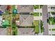 Aerial view of a neighborhood with houses featuring well-kept lawns and cars parked on the streets at 9024 Alba Ln, Kissimmee, FL 34747