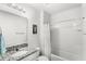 Full bathroom features a shower-tub combo with granite countertops at 9024 Alba Ln, Kissimmee, FL 34747