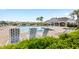 Community pool with lounge chairs and shaded clubhouse at 9024 Alba Ln, Kissimmee, FL 34747