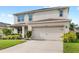 Charming two-story home featuring a two-car garage and well-maintained landscaping at 9024 Alba Ln, Kissimmee, FL 34747