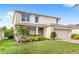 Charming two-story home featuring a two-car garage and well-maintained landscaping at 9024 Alba Ln, Kissimmee, FL 34747
