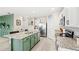 Bright kitchen with an island, stainless steel appliances and granite countertops at 9024 Alba Ln, Kissimmee, FL 34747