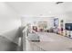 Spacious upstairs loft features a cozy sitting area, bright windows, and play area at 9024 Alba Ln, Kissimmee, FL 34747