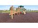 Community playground and play structures on a rubber surface at 9024 Alba Ln, Kissimmee, FL 34747