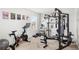 Well-lit workout room with complete exercise system and stationary bike at 9024 Alba Ln, Kissimmee, FL 34747