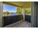 Balcony showcasing serene lake views with swaying palm trees in the distance at 936 Lake Destiny Rd # G, Altamonte Springs, FL 32714